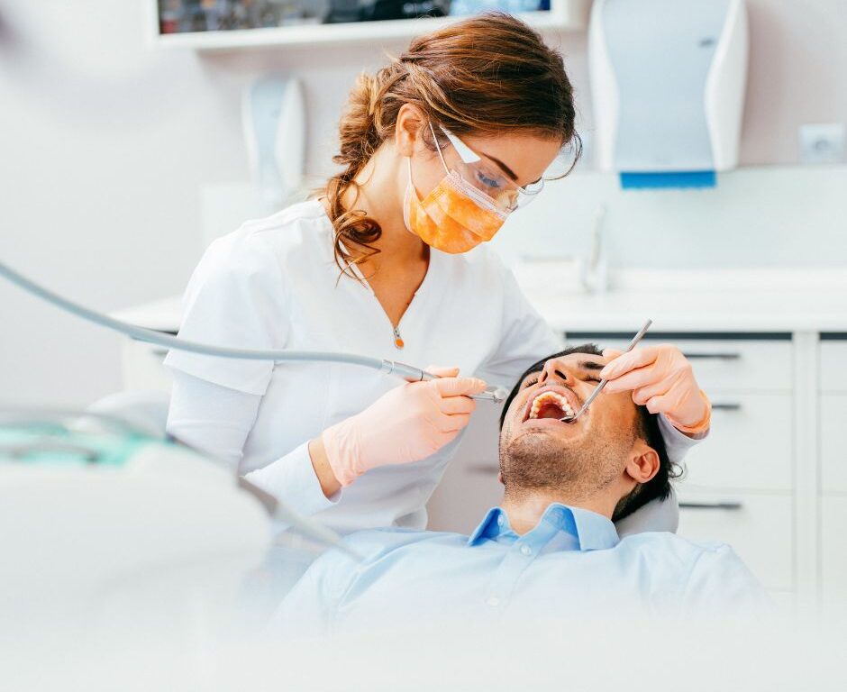 Dentist checking her patient for Routine Dental Care